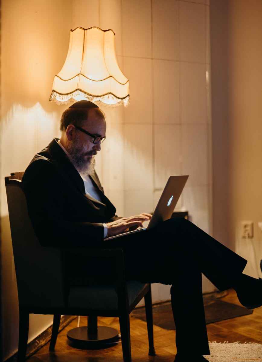 man laptop typing macbook