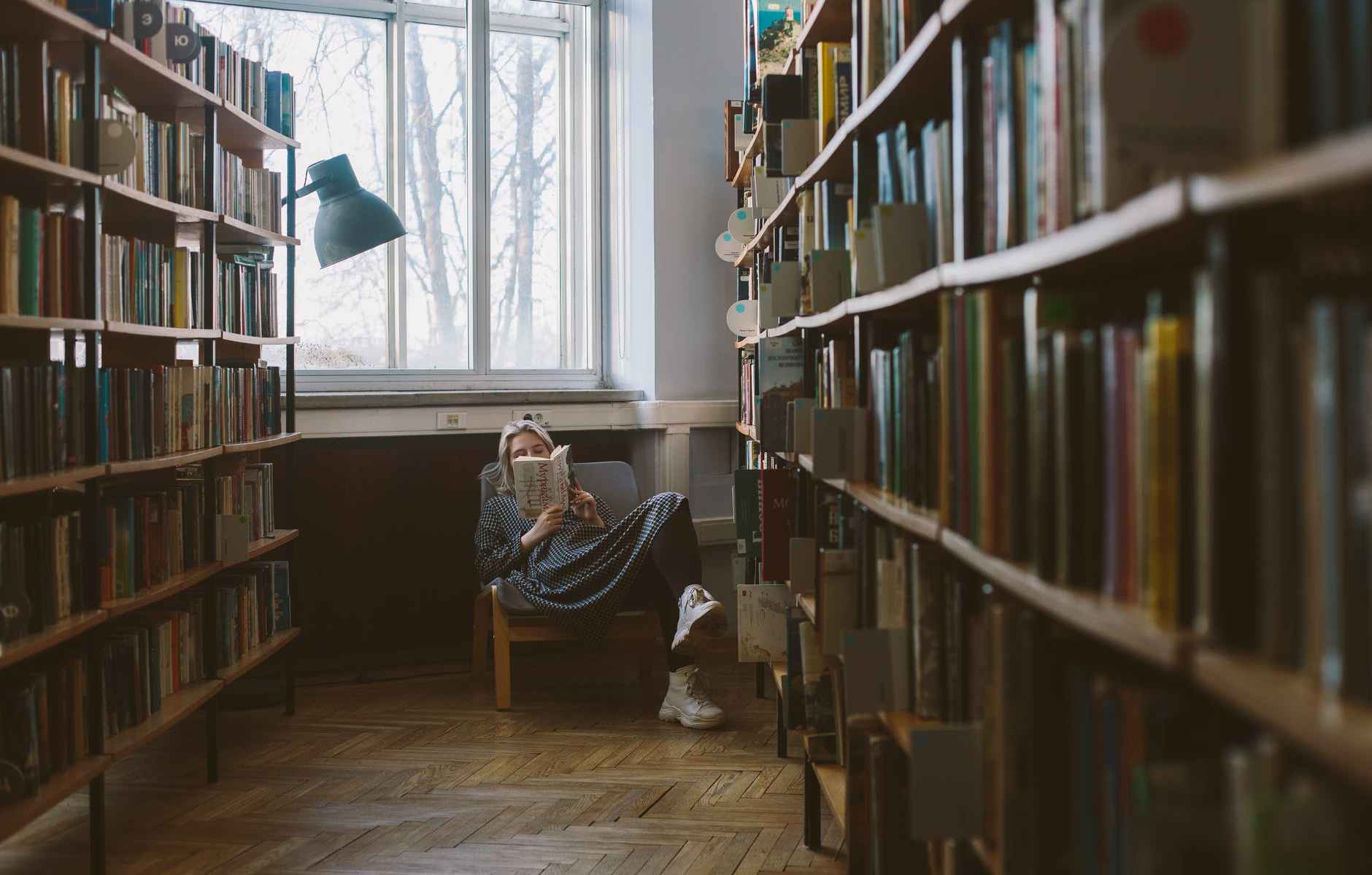 photo of woman reading book